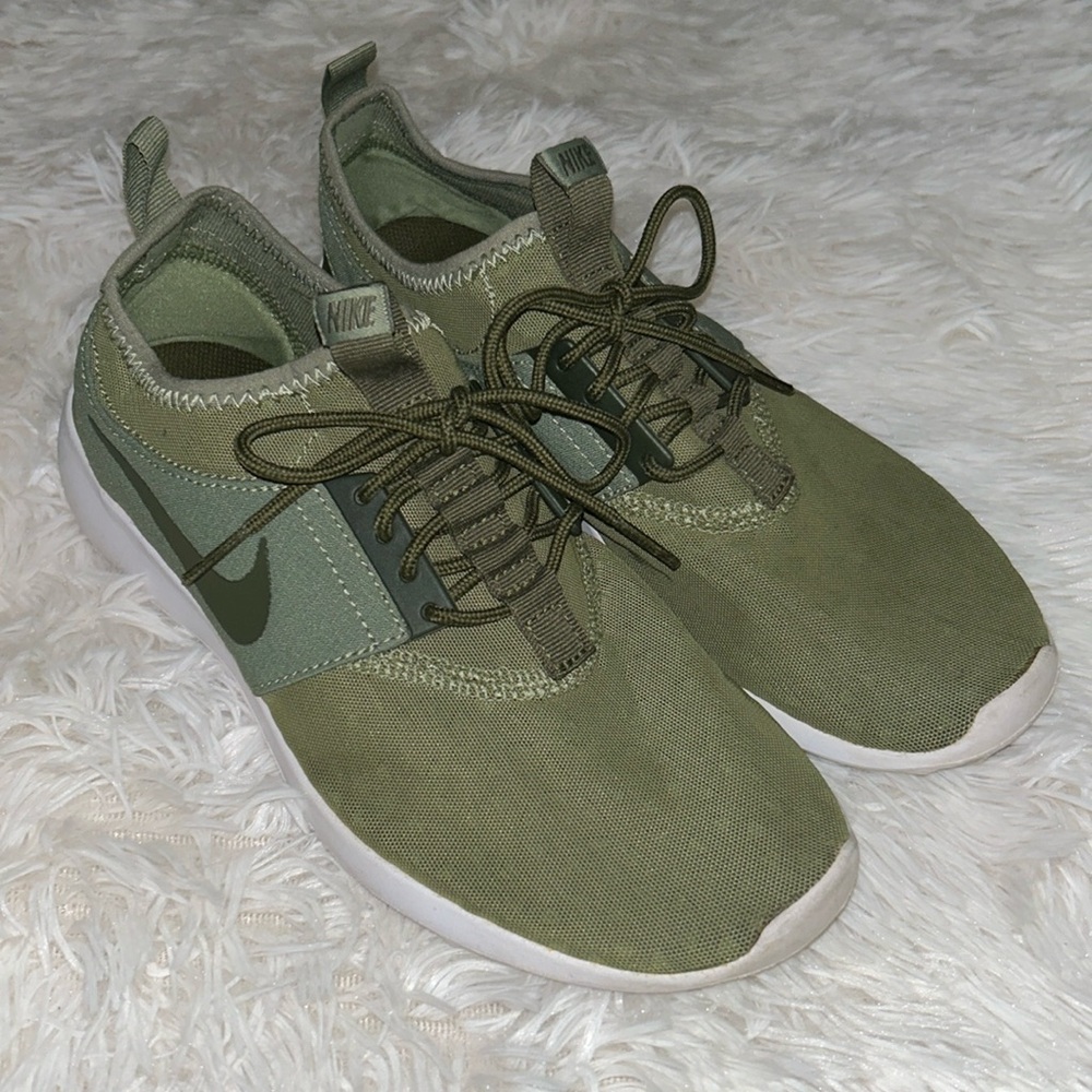 Olive green Nike shoes.